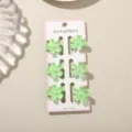 Zoete mintgroene 2,5 cm mini bloemen haarklemmen, set van 6 op een displaykaart - Parelmoer Grasgroen