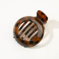 Elegante pinza per capelli rotonda con motivo tartarugato - Leopardo Giallo Lucido