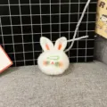 Detailed close-up of a cute white plush bunny keychain with a green hair clip. - Single OPP Bag Packaging / Mint Green