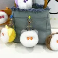 Close-up of cute plush cat head keychains attached to a stylish denim handbag accessory - Cat Head Style (PJMQ81022) / Single Piece / Gray