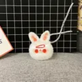 Close-up view of a cute white plush rabbit keychain with red eyes and a tiny hairclip accessory. - Single OPP Bag Packaging / Red