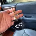 Cute black plush pom-pom monster keychain with white sunglasses and pearl charm accessory - Single OPP Bag Packaging / Black