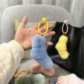 Close-up detail of cute candy-colored plush sock charms for bags and keychains. - Single OPP Bag Packaging / Haze Blue