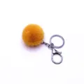 Cute fluffy yellow pom-pom keychain with silver metal ring and clasp for bag charm - Single OPP Bag Packaging / Turmeric