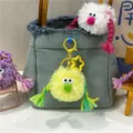 Cute yellow furry monster plush doll keychain with braids decoration on denim bag - 1 Piece / Yellow