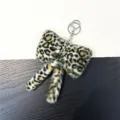Soft leopard print plush bow keychain accessory with silver metal ring for handbags - Off White