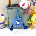 Cute blue plush monster keychain with colorful braids hanging on a denim tote bag - 1 Piece / Sky Blue