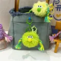 Quirky plush monster keychain with colorful braids for bag decoration - 1 Piece / Green