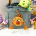 Cute quirky orange plush monster doll keychain with braids for creative bag charm gift - 1 Piece / Orange