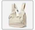 Detailed view of the quilted pet carrier backpack in white, showing breathable design and straps. - Off White