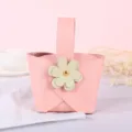 Elegant pink leather wedding favor bag with cream flower decor, perfect for candy gifts. - Pink with Green Flower / Pink