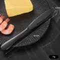 Schwarzes Buttermesser aus Edelstahl mit Löchern zum einfachen Streichen - L / Schwarz