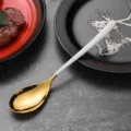 Elegant gold and white handle stainless steel spoon for sophisticated modern table settings - Dinner Spoon / White