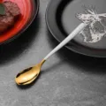 Minimalist stainless steel spoon with moonlight gold bowl and white handle variant - Tea Spoon / White
