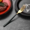 Elegant stainless steel fork with gold finish and dark green handle for modern dining decor - Dinner Fork / Dark Green