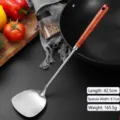 Professional stainless steel spatula with a long wooden handle for home cooking use. - Spatula