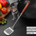 Professional stainless steel slotted turner spatula featuring a long natural wood handle - Slotted Spatula