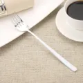 Elegant 304 stainless steel dinner fork with a long white handle in a lifestyle setting - Fork / White