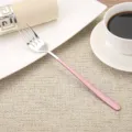 Elegant 304 stainless steel dinner fork with a long pink painted handle on a table. - Fork / Pink