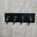 Wall-mounted coat hook with four metal hooks black base for kitchen and bathroom - Black