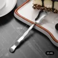 Mini stainless steel dessert spoon with creative wavy handle design, measuring 13cm in length - Wavy Handle Dessert Spoon