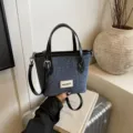 Stylish blue denim bucket bag featuring black top handles and a long adjustable strap - Small (Without Pendant) / Black