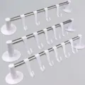 Three tiers of wall-mounted stainless steel towel rails with multiple white plastic hooks - White