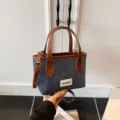 Minimalist denim blue bucket bag featuring brown leather handles and crossbody strap - Small (Without Pendant) / Brown