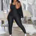 Textured one-piece yoga jumpsuit activewear detail view showcasing flexible fabric style - S / Black