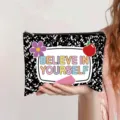 Close-up of a canvas pouch featuring a Believe in Yourself quote and notebook pattern - Black and White Spot (Believe in yourself)