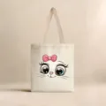 Vista detallada de una bolsa de lona crema con un lindo estampado de cara de gato. - Cara de Gato de Dibujos Animados (jiayingstd127) / 34*39cm