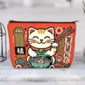 Vibrant canvas makeup pouch featuring a cute Maneki-neko cat eating ramen design - Lucky Cat Cartoon Style