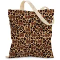 Close-up detail of the leopard print canvas tote bag featuring brown bowtie patterns - Leopard Print Bow (jiayingstd356) / 34x39cm