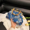 Elegant wave embroidery evening bag with bamboo handle and gold chain strap. - Blue