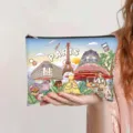Vintage Paris themed illustration makeup bag held in hand showing the compact size - Cafe Paris (jiayingpbb0446)