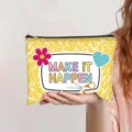 Close-up of yellow canvas zipper pouch with 'MAKE IT HAPPEN' text and colorful graphics - Bright Yellow (Make it happen)