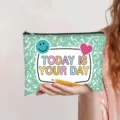 Close-up of a hand holding a mint green canvas pouch with Today Is Your Day quote. - Light Green (Today is your day)