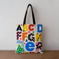 Detailed view of the vibrant geometric alphabet print on a thick canvas tote bag. - White Vintage Letters Style (jiayingstd138) / 34x39cm