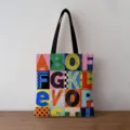 Close-up detail of a canvas tote bag featuring a vibrant geometric alphabet pattern - Artistic Geometric Letters Style (jiayingstd139) / 34x39cm