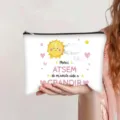 Close-up of white canvas pouch with cartoon sun and French teacher appreciation text - French Style (Sun ATSEM)
