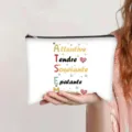 Close-up detail of canvas makeup pouch featuring French ATSEM acronym design - French Style (ATSEM Acrostic)