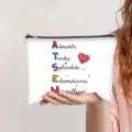 Canvas zipper pouch with ATSEM French inspirational words held by a person in hand - French Style (ATSEM Scrabble)