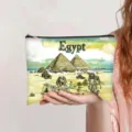 Vintage Egypt oil painting print cosmetic bag shown being held by a model hand - Ancient Egypt (jiayingpbb0455)
