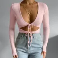 Stylish pink ribbed long sleeve deep v-neck crop top featuring front tie cutout detail. - S / Tops / Pink