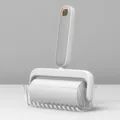 Modern minimalist color-blocked lint roller with storage base, perfect for removing pet hair. - Grayish White