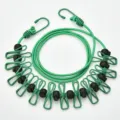 Portable outdoor elastic clothesline with windproof hooks and clips for travel laundry drying. - Green with Positioning