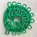 Portable outdoor travel clothesline with clips, elastic windproof drying rope for home use. - OPP Packaging / Green