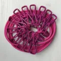 Portable outdoor elastic clothesline with clips, coiled neatly on white background for travel. - OPP Packaging / Rose Red