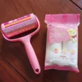 Pink lint roller with refill sticky paper set for clothes cleaning, 10cm width 60 layers design. - 1 Lint Roller Set (Wrapped) + 2 Refill Rolls (35 Sheets)