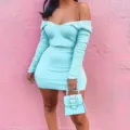 Close-up view of the light blue ribbed knit long sleeve crop top and mini skirt set detail. - M / Cyan